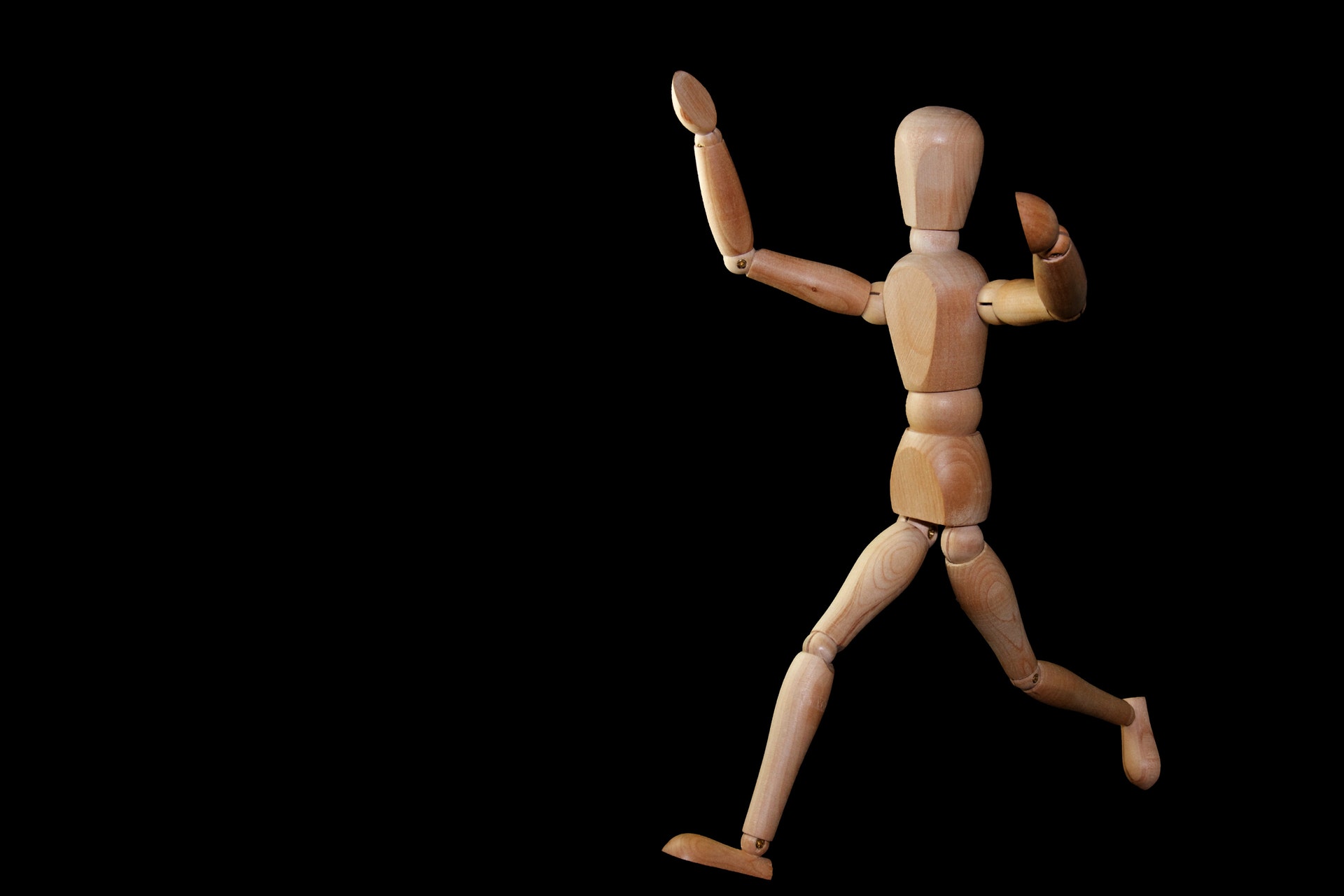timelapse-photography-of-brown-wooden-puppet-running-on-a-220443.jpg